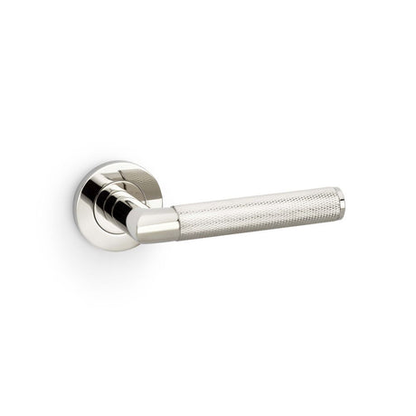 This is an image showing Alexander & Wilks Harrier Knurled Lever on Round Rose - Polished Nickel PVD aw210pnpvd available to order from Trade Door Handles in Kendal, quick delivery and discounted prices.