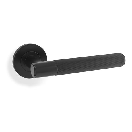 This is an image showing Alexander & Wilks Spitfire Reeded Lever on Round Rose - Black aw222bl available to order from Trade Door Handles in Kendal, quick delivery and discounted prices.