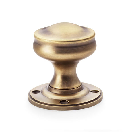 This is an image showing Alexander & Wilks Harris Door Knob - Antique Brass aw301-50-ab available to order from Trade Door Handles in Kendal, quick delivery and discounted prices.