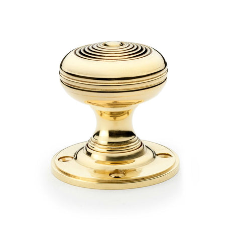 This is an image showing Alexander & Wilks Christoph Mortice Knob - Unlacquered Brass aw303-50-ub available to order from Trade Door Handles in Kendal, quick delivery and discounted prices.