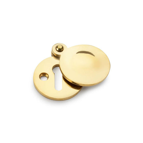 This is an image showing Alexander & Wilks Standard Key Profile Round Escutcheon with Harris Design Cover - Unlacquered Brass aw381-ub available to order from Trade Door Handles in Kendal, quick delivery and discounted prices.