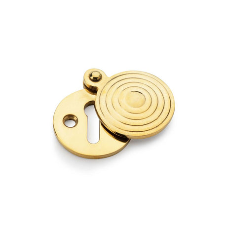 This is an image showing Alexander & Wilks Standard Key Profile Round Escutcheon with Christoph Design Cover - Unlacquered Brass aw382-ub available to order from Trade Door Handles in Kendal, quick delivery and discounted prices.