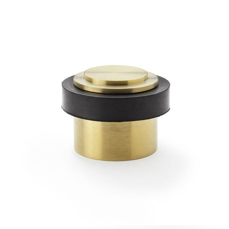 This is an image showing Alexander & Wilks Plain Floor Mounted Door Stop - Satin Brass PVD aw603sbpvd available to order from Trade Door Handles in Kendal, quick delivery and discounted prices.