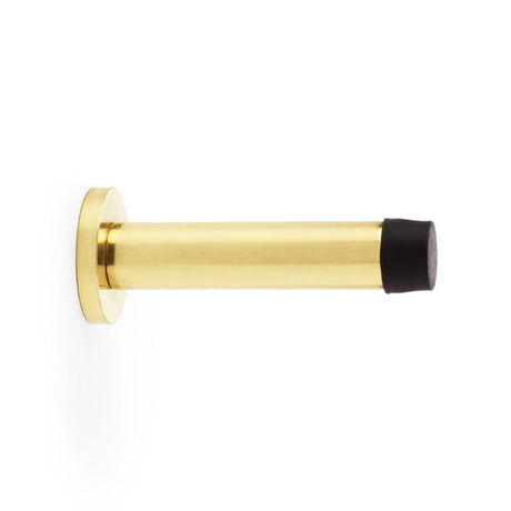 This is an image showing Alexander & Wilks Cylinder Projection Door Stop on Rose - Polished Brass Lacquered aw616pbl available to order from Trade Door Handles in Kendal, quick delivery and discounted prices.