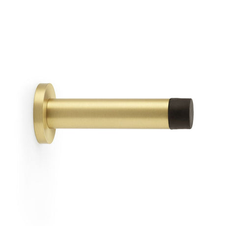 This is an image showing Alexander & Wilks Cylinder Projection Door Stop on Rose - Satin Brass aw616sb available to order from Trade Door Handles in Kendal, quick delivery and discounted prices.