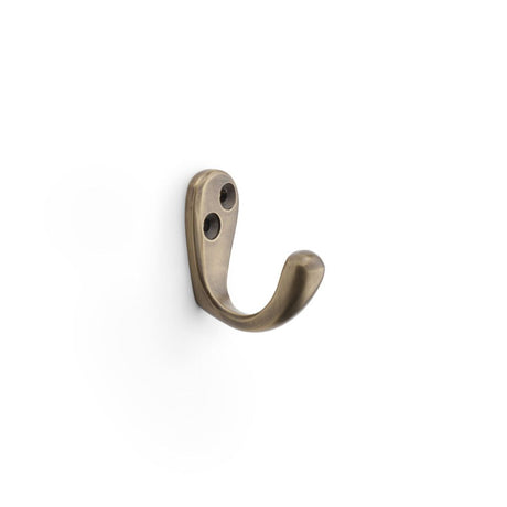 This is an image showing Alexander & Wilks Victorian Single Robe Hook - Antique Brass aw774ab available to order from Trade Door Handles in Kendal, quick delivery and discounted prices.