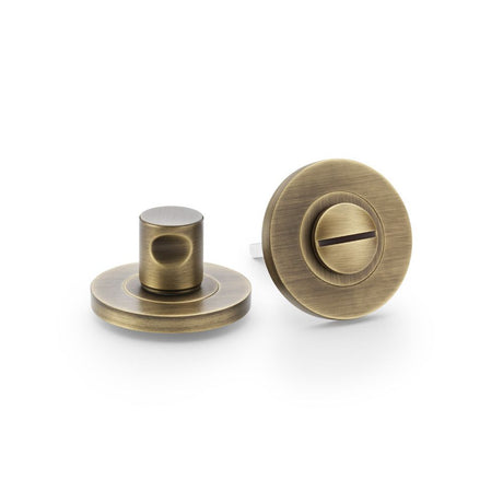 This is an image showing Alexander & Wilks Plain Thumbturn and Release - Antique Brass aw791ab available to order from Trade Door Handles in Kendal, quick delivery and discounted prices.