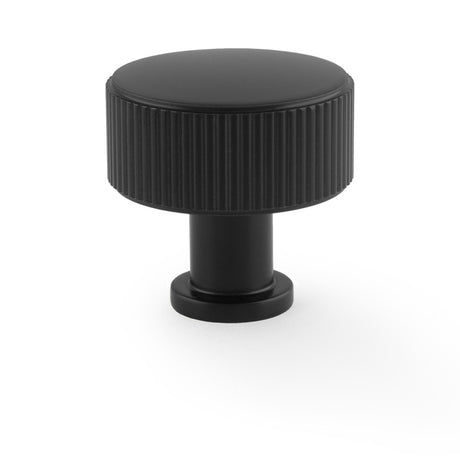 This is an image showing Alexander & Wilks Lucia Reeded Cupboard Knob - Black - 35mm aw807r-35-bl available to order from Trade Door Handles in Kendal, quick delivery and discounted prices.