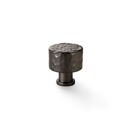 This is an image showing Alexander & Wilks Leila Hammered Cupboard Knob - Dark Bronze - 30mm aw816-30-dbz available to order from Trade Door Handles in Kendal, quick delivery and discounted prices.
