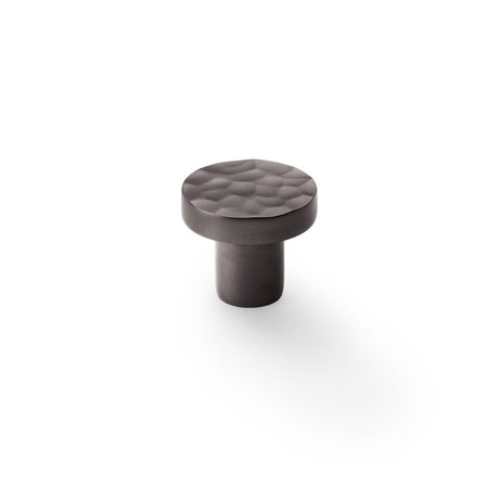 This is an image showing Alexander & Wilks Hanover Hammered Cupboard Knob - Dark Bronze - 30mm aw820-30-dbz available to order from Trade Door Handles in Kendal, quick delivery and discounted prices.