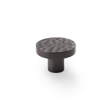 This is an image showing Alexander & Wilks Hanover Hammered Cupboard Knob - Dark Bronze - 38mm aw820-38-dbz available to order from Trade Door Handles in Kendal, quick delivery and discounted prices.