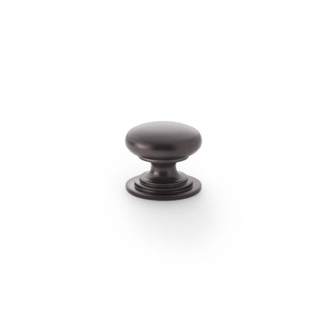 This is an image showing Alexander & Wilks Waltz Round Cupboard Knob on Stepped Rose - Dark Bronze - 25mm aw825-25-dbz available to order from Trade Door Handles in Kendal, quick delivery and discounted prices.
