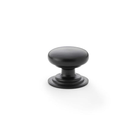 This is an image showing Alexander & Wilks Waltz Round Cupboard Knob on Stepped Rose - Black - 32mm aw825-32-bl available to order from Trade Door Handles in Kendal, quick delivery and discounted prices.