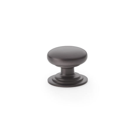 This is an image showing Alexander & Wilks Waltz Round Cupboard Knob on Stepped Rose - Dark Bronze - 32mm aw825-32-dbz available to order from Trade Door Handles in Kendal, quick delivery and discounted prices.