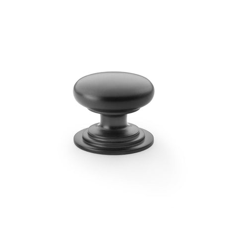 This is an image showing Alexander & Wilks Waltz Round Cupboard Knob on Stepped Rose - Black - 38mm aw825-38-bl available to order from Trade Door Handles in Kendal, quick delivery and discounted prices.