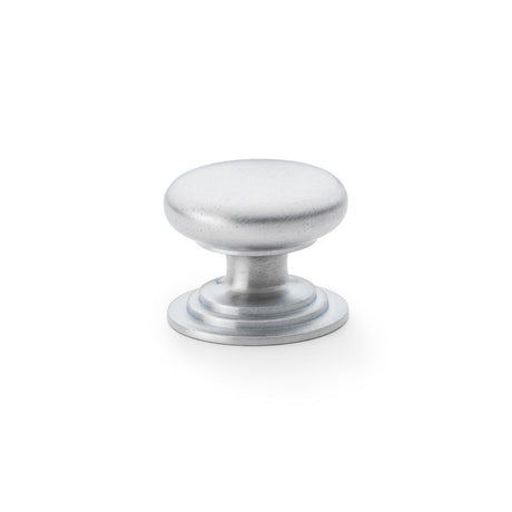 This is an image showing Alexander & Wilks Waltz Round Cupboard Knob on Stepped Rose - Satin Chrome - 38mm aw825-38-sc available to order from Trade Door Handles in Kendal, quick delivery and discounted prices.