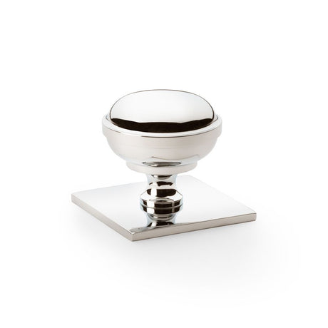 This is an image showing Alexander & Wilks Quantock Cupboard Knob on Square Backplate - Polished Nickel - 38mm aw826-38-pn available to order from Trade Door Handles in Kendal, quick delivery and discounted prices.