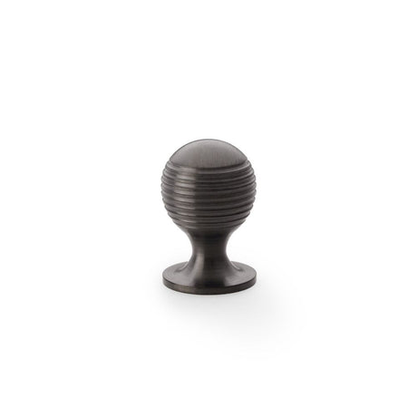 This is an image showing Alexander & Wilks Caesar Cupboard Knob on Round Rose - Dark Bronze PVD - 25mm aw832-25-dbzpvd available to order from Trade Door Handles in Kendal, quick delivery and discounted prices.