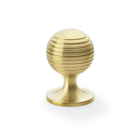 This is an image showing Alexander & Wilks Caesar Cupboard Knob on Round Rose - Satin Brass PVD - 38mm aw832-38-sbpvd available to order from Trade Door Handles in Kendal, quick delivery and discounted prices.