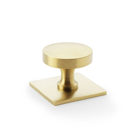 This is an image showing Alexander & Wilks Bullion Cupboard Knob on Square Backplate - Satin Brass PVD aw835-38-sbpvd available to order from Trade Door Handles in Kendal, quick delivery and discounted prices.