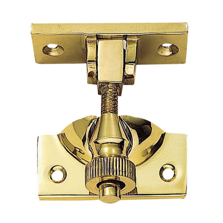 This is an image of a Carlisle Brass - Brighton Pattern Sash Fastener - Polished Brass that is availble to order from Trade Door Handles in Kendal.