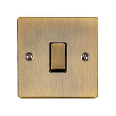 This is an image showing Eurolite Enhance Decorative Intermediate Switch - Antique Brass (With Black Trim) enintabb available to order from trade door handles, quick delivery and discounted prices.