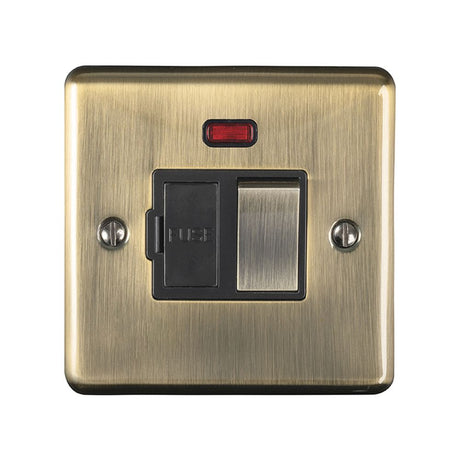 This is an image showing Eurolite Enhance Decorative Switched Fuse Spur With Neon Indicator - Antique Brass (With Black Trim) enswfnabb available to order from trade door handles, quick delivery and discounted prices.