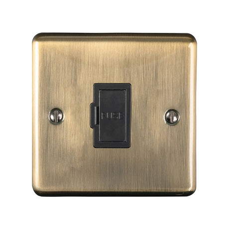 This is an image showing Eurolite Enhance Decorative Unswitched Fuse Spur - Antique Brass (With Black Trim) enuswfabb available to order from trade door handles, quick delivery and discounted prices.