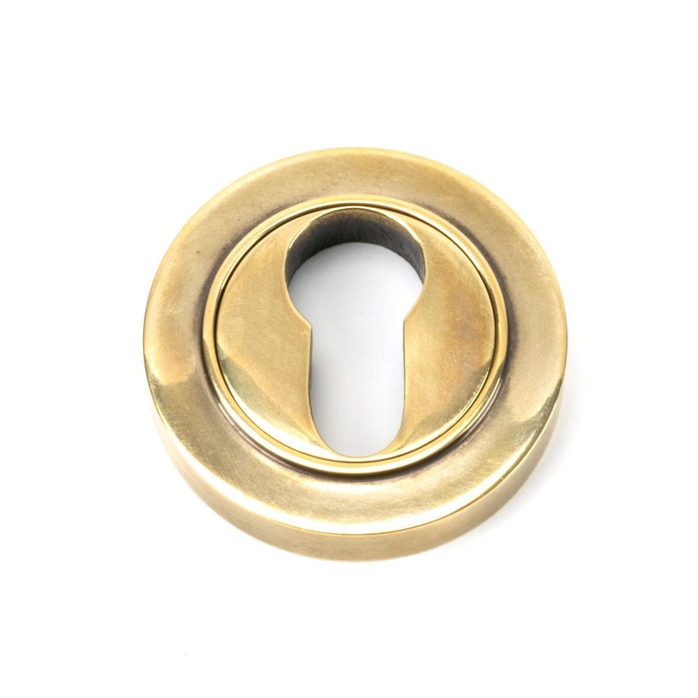 From The Anvil Door Furniture Aged Brass / Euro Profile Escutcheons From The Anvil - Aged Brass Round Euro Escutcheon (Plain)