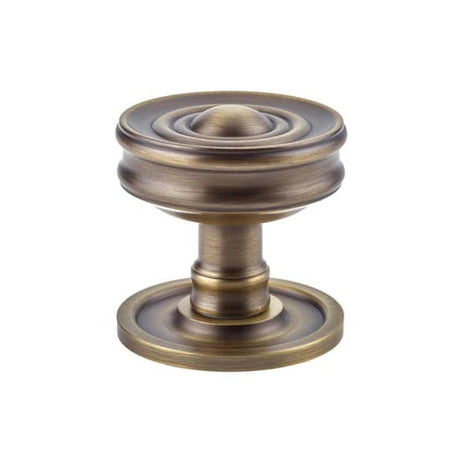 This is an image of a Burlington - Bloomury Mortice knob - Antique Brass  that is availble to order from Trade Door Handles in Kendal.