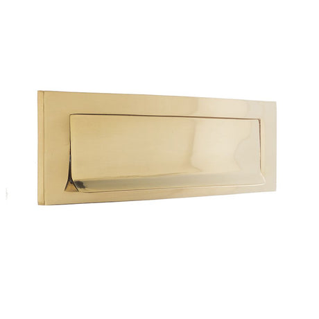 This is an image of a Frelan - Gravity Letter Plate 254x76mm - Polished Brass  that is availble to order from Trade Door Handles in Kendal.