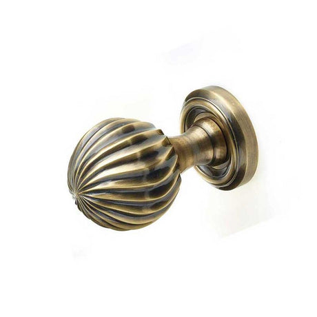 This is an image of a Frelan - Parisian Unsprung Mortice Knobs - Antique Brass  that is availble to order from Trade Door Handles in Kendal.