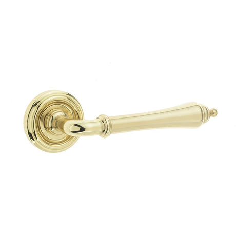 This is an image of a Frelan - Camille Levers on Round Rose - Polished Brass  that is availble to order from Trade Door Handles in Kendal.