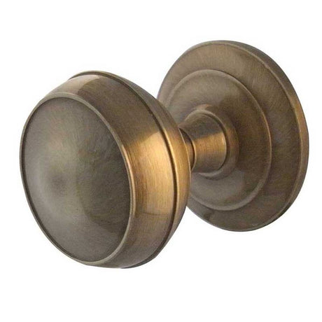 This is an image of a Frelan - Coronet Unsprung Mortice Knobs - Antique Brass  that is availble to order from Trade Door Handles in Kendal.