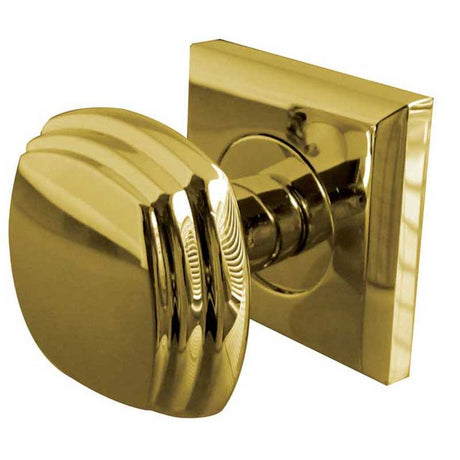 This is an image of a Frelan - Piazza Unsprung Mortice Knobs on a Square Rose - Polished Brass  that is availble to order from Trade Door Handles in Kendal.