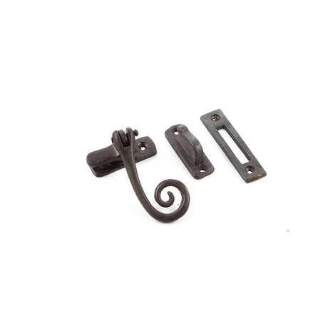 This is an image of a Frelan - Valley Forge Curly Tail Casement Fastener - Beeswax  that is availble to order from Trade Door Handles in Kendal.