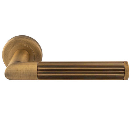 This is an image of a Serozzetta - Serozzetta Trend Lines Lever On rose - Antique Brass that is availble to order from Trade Door Handles in Kendal.