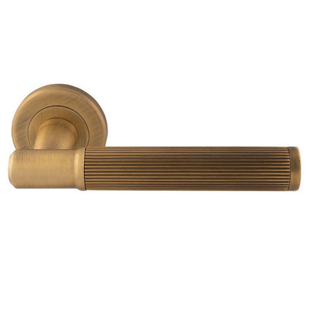 This is an image of a Serozzetta - Serozzetta Image Lines Lever On rose - Antique Brass that is availble to order from Trade Door Handles in Kendal.