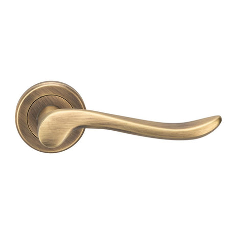 This is an image of a Serozzetta - Serozzetta Verdun Lever On Rose - Antique Brass that is availble to order from Trade Door Handles in Kendal.
