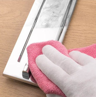 Image showing a polished chrome letter plate been cleaned