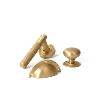 Image showing a range of From The Anvil Door Handles and Cabinet Hardware in Satin Brass