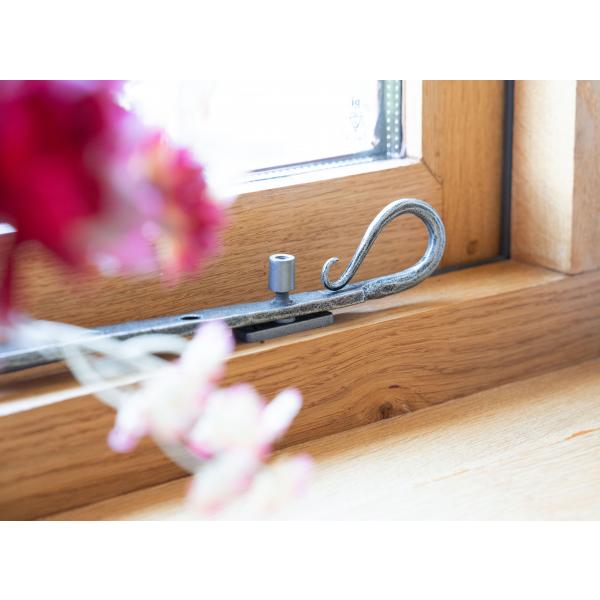 This is an image showing a Pewter casement stay with a locking pin
