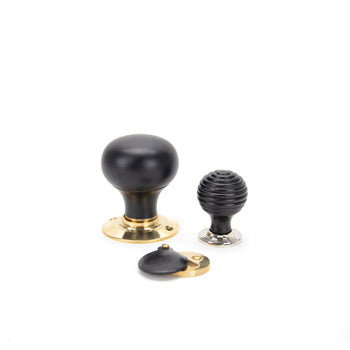 Image showing a collection of From The Anvil Ebony Door Knobs and Cabinet Knobs.  Available to order from Trade Door Handles in Kendal.