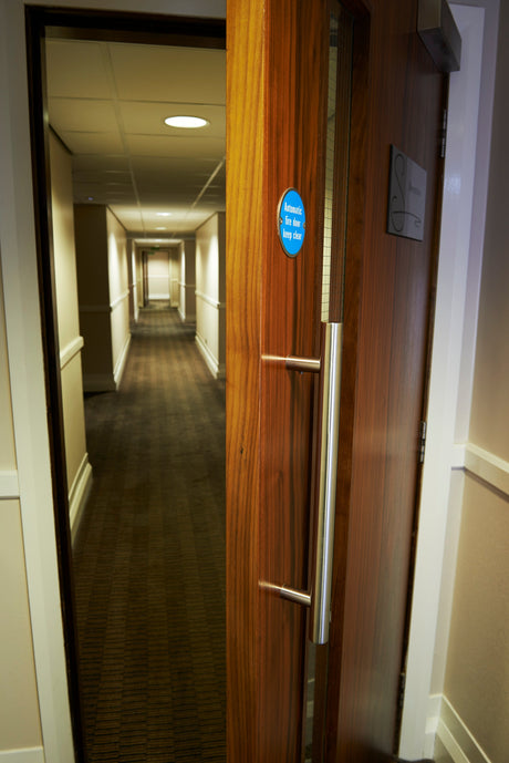 This is an image showing a open door with a pull handle on it