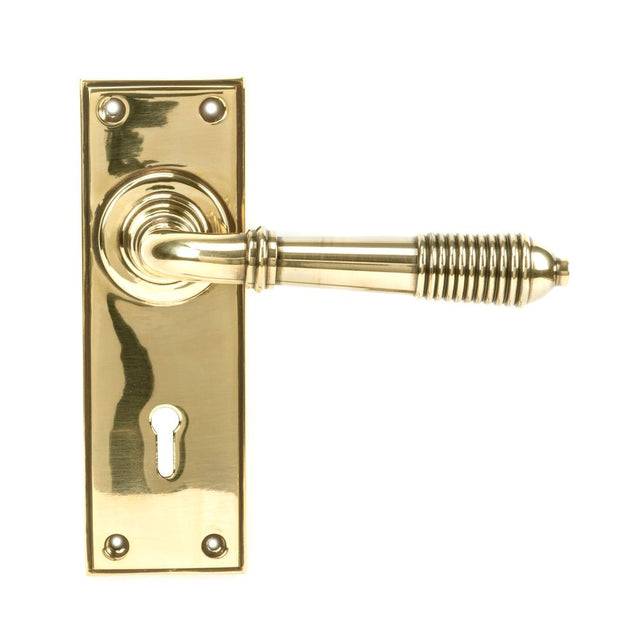 From The Anvil - Aged Brass Reeded Lever Lock Set | Sku. 33040 | Trade Door Handles.