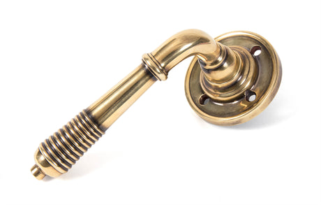 From The Anvil - Aged Brass Reeded Lever on Rose Set | Sku. 33087 | Trade Door Handles.