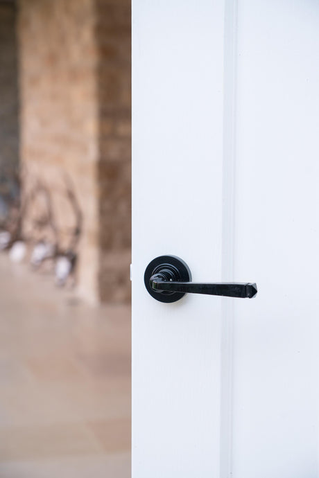 From The Anvil - Black Avon Round Lever on Rose Set (Plain) | Sku. 45623 | Trade Door Handles.