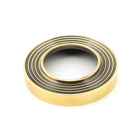 From The Anvil - Aged Brass Newbury Lever on Rose Set (Beehive) | Sku. 45757 | Trade Door Handles.