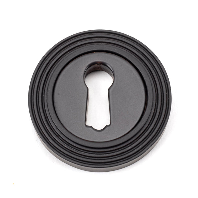 From The Anvil - Aged Bronze Round Escutcheon (Beehive) | Sku. 46115 | Trade Door Handles.