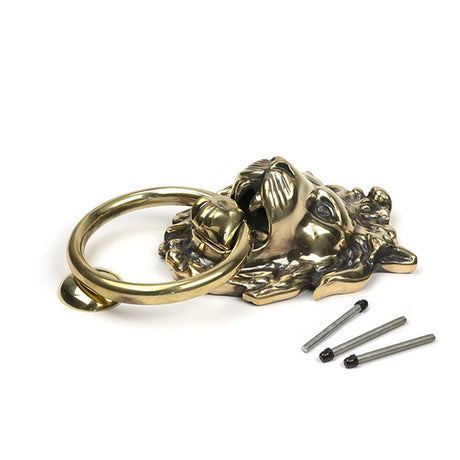 High quality images of the From The Anvil - Aged Brass Lion Head Door Knocker | Sku. Anvil-46722 | available to order from Trade Door Handles, quick delivery at discounted prices.